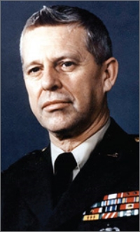 Image of a uniformed member, a past director of D-I-A