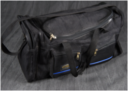 A black canvas duffel bag with multiple zippered compartments and a blue accent stripe, displayed on a dark fabric background.