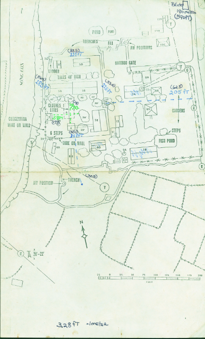 Aerial imagery of the Son Tay POW camp, detailing buildings, guard towers, and key features with handwritten notes and measurements used for intelligence and planning.
