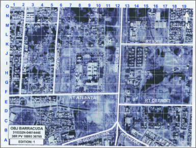 An overhead satellite image of a city grid labeled with route names like RT CHICAGO and RT ATLANTA, identifying the area as OBJ BARRACUDA for a military operation.