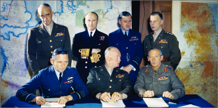 Image of 7 military leaders posing for a picture from various nations.
