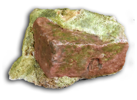 A surveillance and concealment device designed to look like a rock with green moss, shown against a black background.