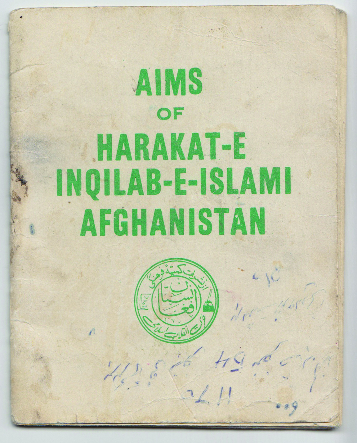Image of a small off-white book with green text on the front.