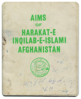 Image of a small off-white book with green text on the front.