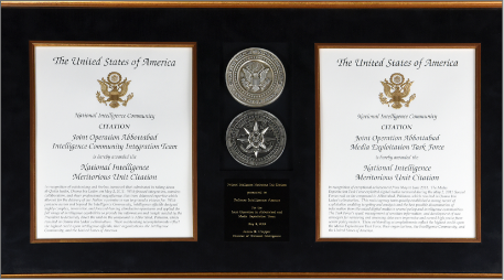 Image of two official certificate documents separated by 2 stacked coins depicting front and back graphics.