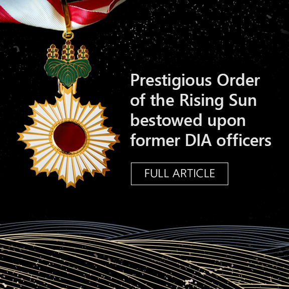 Feature graphic a medal of recognition. Main title. Prestigious order of the Rising Sun bestowed upon former DIA Officers.