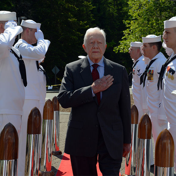 Image of a man being saluted